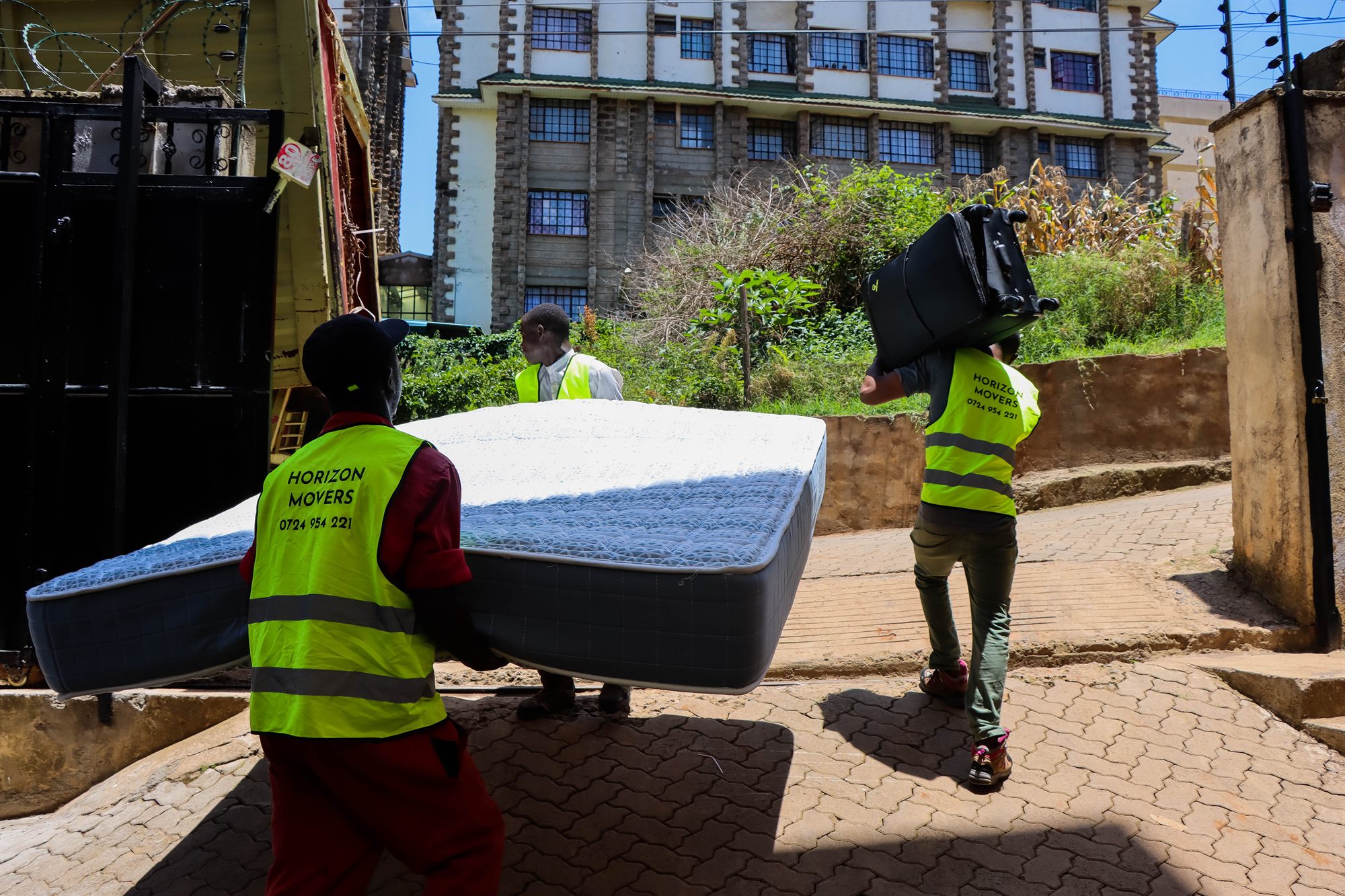 Horizon Movers team carrying a mattress